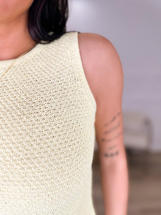 Oat knit sleeveless cropped top close-up showing textured fabric stitch pattern