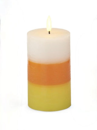LED pillar candle with white top, orange band, and yellow bottom; steady flame