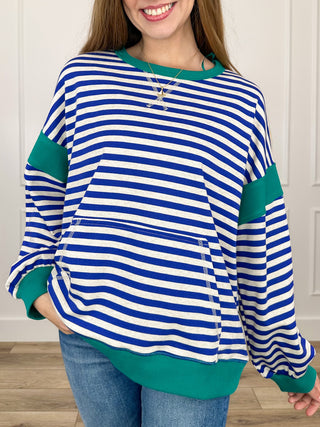Striped knit long-sleeve top in blue and white with green contrast hem and cuffs