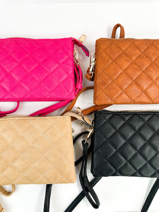 Quilted faux-leather crossbody bags in pink, tan, brown, and black, zip tops