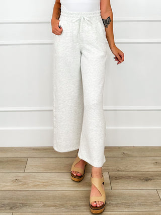Light grey high-rise wide-leg bottoms with elastic drawstring waist