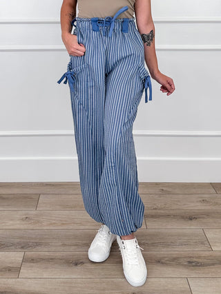 High-rise knit striped pants with elastic waist and drawstring, blue pinstripe with tie accents