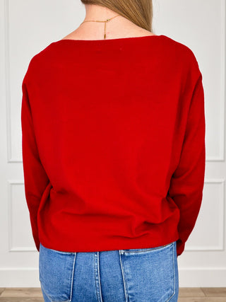 Red knit long-sleeve pullover top, back view