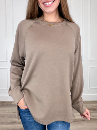 Taupe ribbed long-sleeve top with raglan sleeves and crew neck