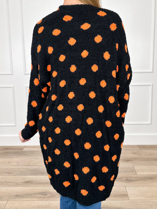 Reversible long-sleeve knit cardigan, black with orange dot pattern, back view