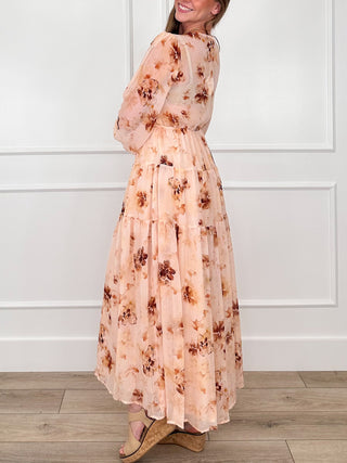 Peach floral button-up maxi dress, back view with long sleeves and tiered hem