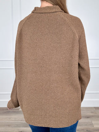 Brown knit long-sleeve sweater with high turtleneck, back view