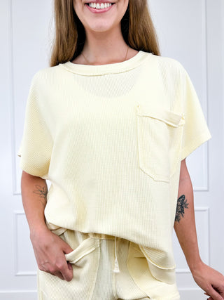 Cream cotton-blend short-sleeve top with crew neck and chest pocket