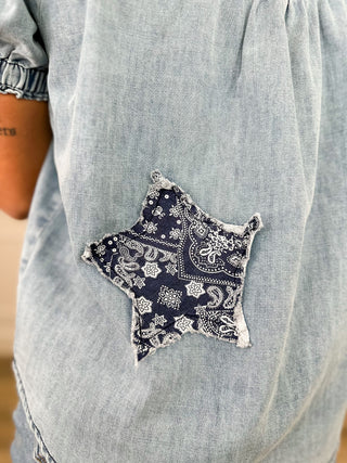 Embroidered star patch on light wash denim short-sleeve top back