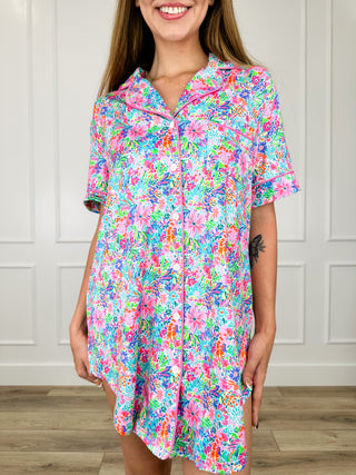 Pink floral button-up sleep dress with short sleeves, collar, and front button placket