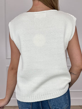 Back view of ivory knit short-sleeve sweater top, ribbed neckline and hem
