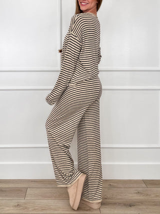 Sand-and-black striped knit set, side view: long-sleeve top and high-rise wide-leg pants.