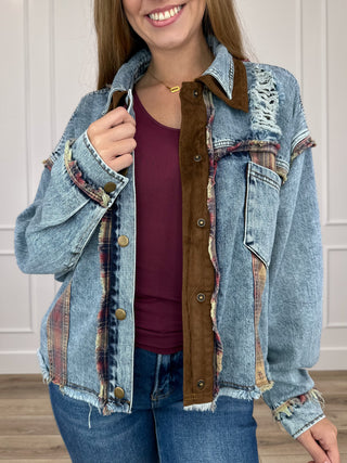 Medium wash denim jacket with brown button placket, front patchwork and chest pockets