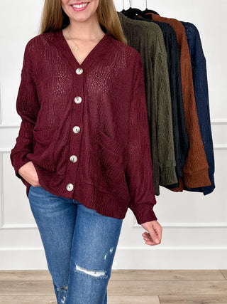 Wine red knit long-sleeve cardigan with V-neck, button front, and patch pockets
