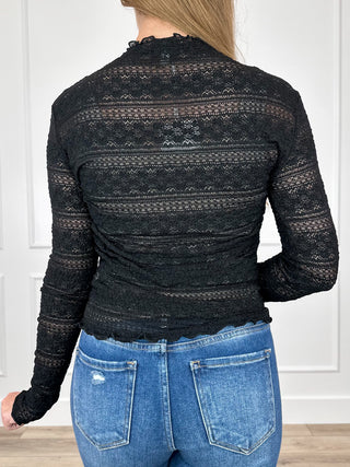 Sheer black mesh long-sleeve top with patterned back and ruched detailing