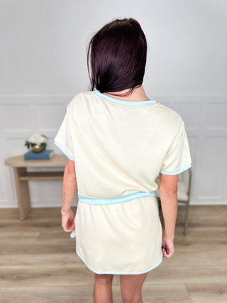 Cream cotton blend skort set, back view with light blue trim and drawstring waistband skort