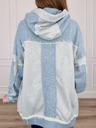 Blue and gray knit hoodie sweatshirt back view with hood, large patchwork panel, long sleeves
