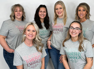 Custom printed t-shirts in Freeland MI, six women wearing gray tees with a full-color pink and teal gradient design