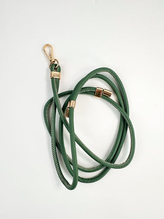 Green faux leather lanyard with gold end clips and looped strap