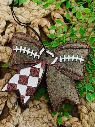Football-themed fabric freshie with maroon edge trim, white laces, and checkered logo