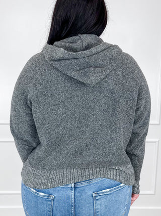 Grey knit hooded sweater, long sleeves; back view with ribbed cuffs and hem.
