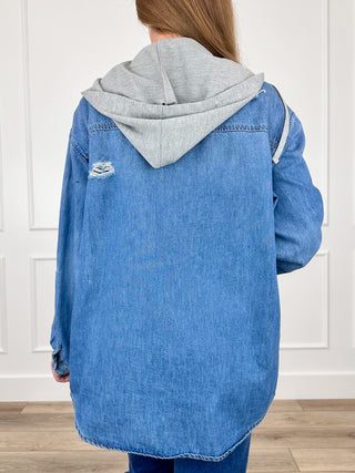 Distressed medium-wash denim hoodie jacket back with gray hood and frayed hem