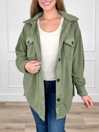Olive green long-sleeve button-up shacket with flap chest pockets and collar