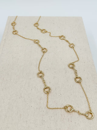 Gold-tone chain necklace with linked oval stations and lobster clasp