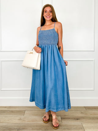 Blue spaghetti-strap dress with smocked bodice and gathered maxi skirt