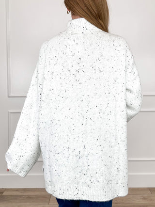 White speckled knit turtleneck long-sleeve sweater, back view
