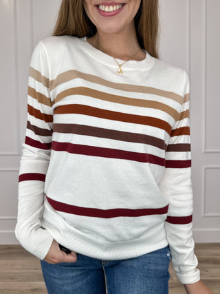 Ombre stripe knit long-sleeve sweater, crew neck; white with rust, tan, maroon bands