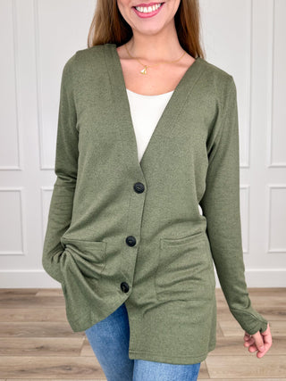 Sage green long-sleeve button-up cardigan with V-neck and patch pockets