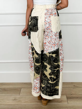 High-rise wide-leg cotton pants, cream patchwork with black camo and floral front panel