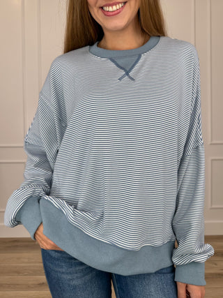 Blue and white striped long-sleeve sweatshirt, crew neck with small tie detail