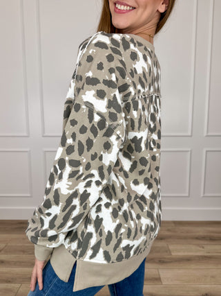 Leopard-print long-sleeve top with relaxed shoulders and banded cuffs, taupe
