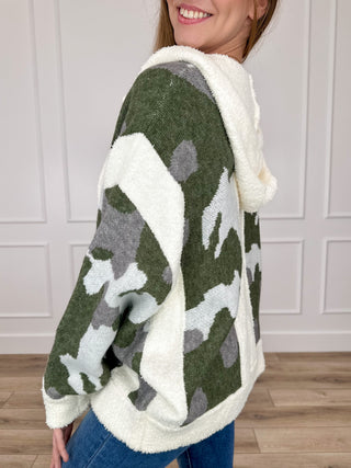 Side view hooded camo knit cardigan with long sleeves, cream trim and contrast pattern