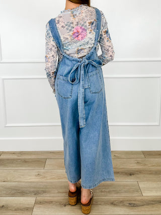 Light wash denim jumpsuit back with tie waist and wide legs