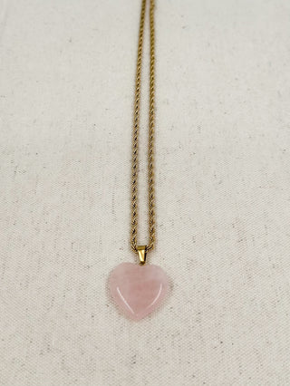 Gold heart pendant necklace with pink heart charm