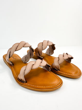 Nude faux leather slide sandals with braided strap and textured footbed