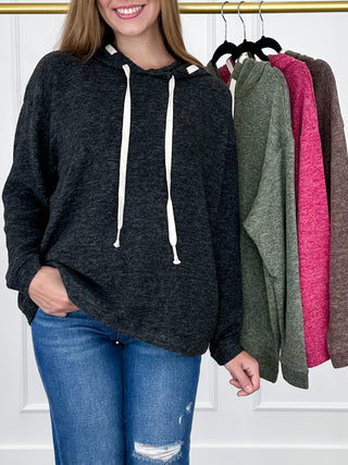 Black heather knit long-sleeve hooded top with white drawstring ties.