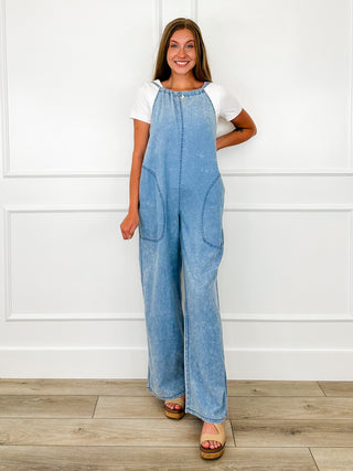 Cotton-blend Avery Mae jumpsuit in blue, adjustable straps, tie-neck, side pockets
