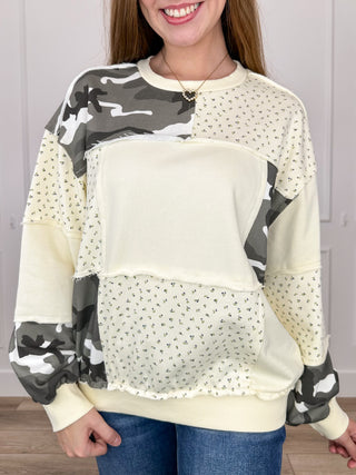 Cream long-sleeve crewneck top with camouflage panel patchwork