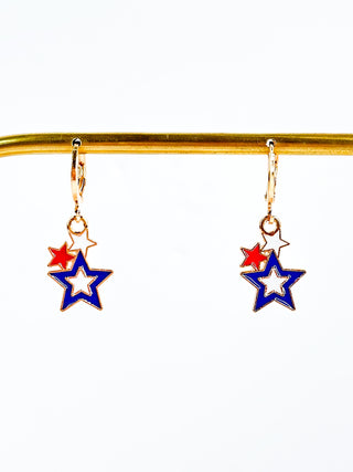 Gold star drop earrings with red and blue enamel stars on gold hooks
