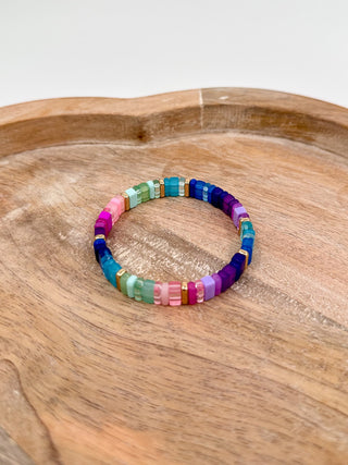 Multicolor beaded bracelet with turquoise, navy, purple, pink and white cube beads