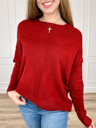 Red knit long-sleeve sweater with crew neck and ribbed cuffs and hem