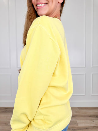 Yellow crewneck sweatshirt, long sleeves, side view