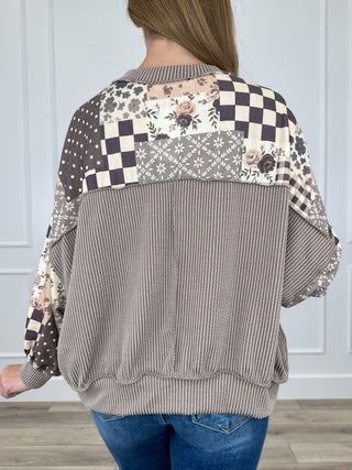 Brown patchwork long-sleeve top back view with ribbed yoke and cuffs