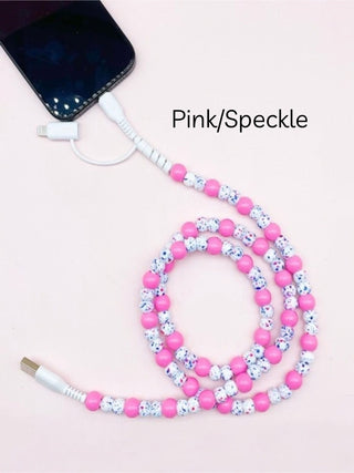 Pink speckled beaded phone charger cable with USB connector and coiled loop
