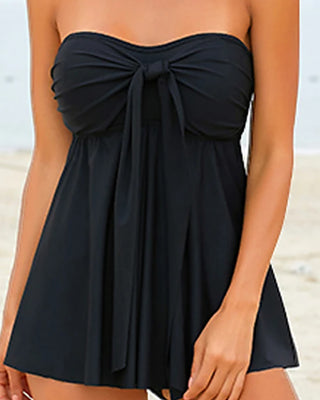 Black strapless skirted swimsuit with ruched bust and tied bow detail