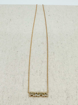Gold necklace with small block-letter MOM pendant on thin chain